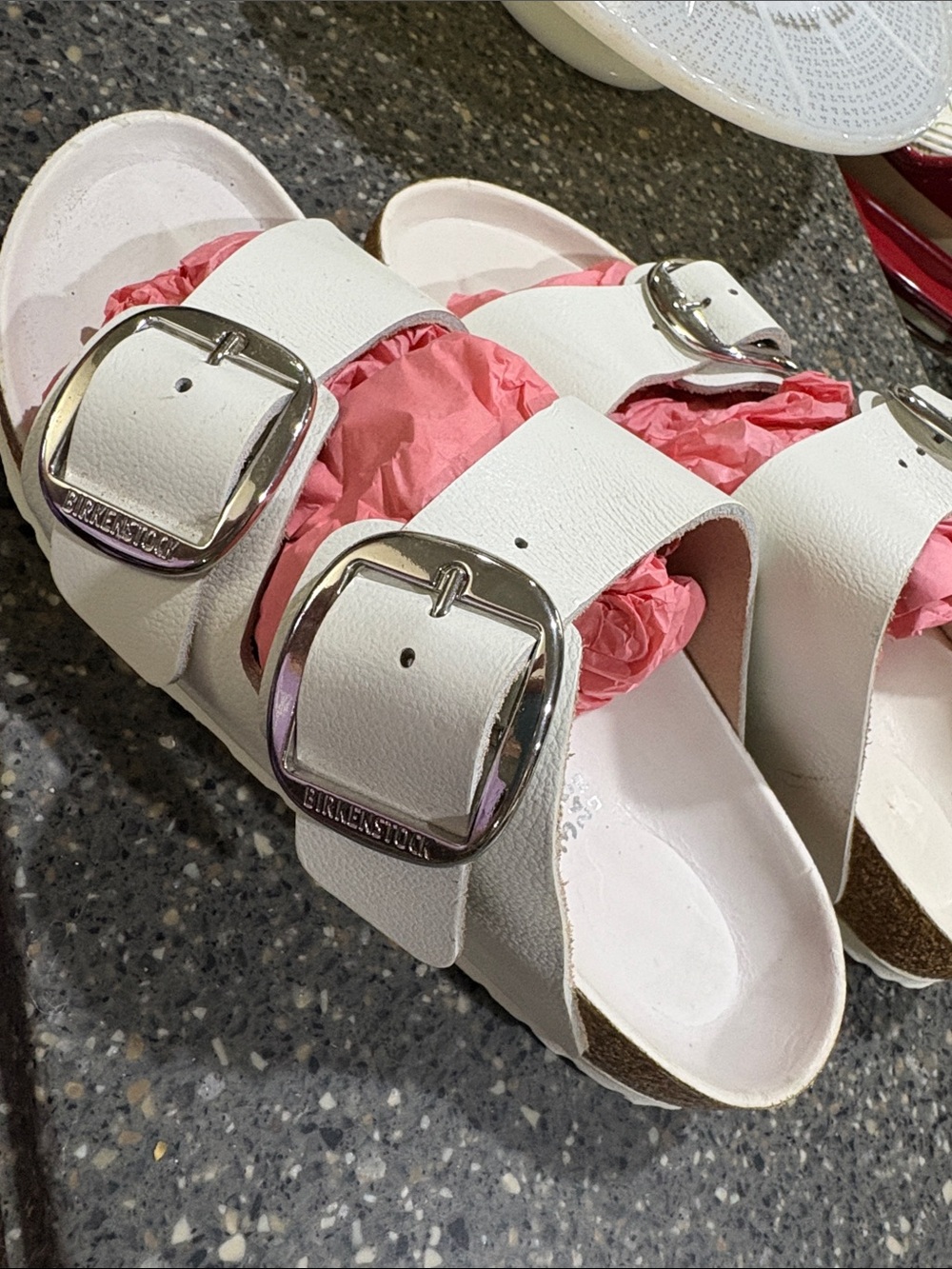 Birkenstock White Two-Strap Sandals with Pink Accents and Silver Buckles